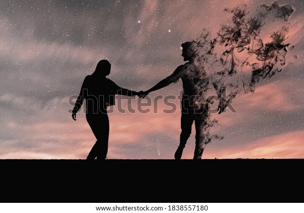 Silhouette of couple in black. The man's figure vanishes in smoke. Concept of end of love, end of love, couple separating, coupled wall art. 