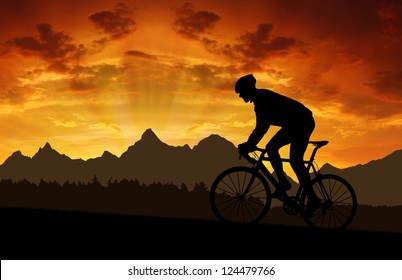 silhouette of the cyclist riding a road bike at sunset - Powered by Shutterstock