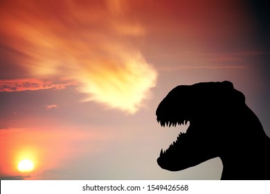 Silhouette Of A Dinosaur Growling At A Incoming Flaming Meteorite For The Concept Of Extinction Event. 