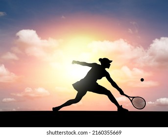 Silhouette of a female tennis player stretch to return a serve shot on a tennis court against a surreal sunset. - Powered by Shutterstock