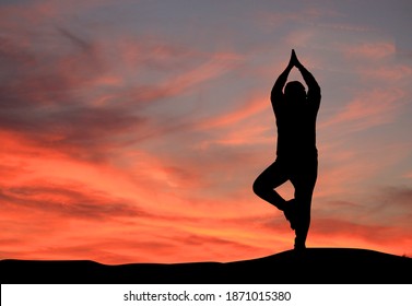 silhouette of a girl practicing yoga, woman doing yoga on the top of the mountain. prayer background. Meditation Background.