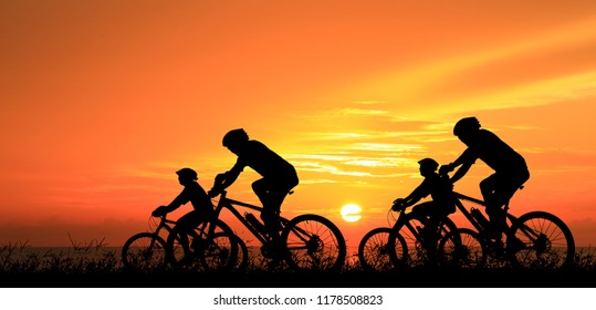 Silhouette group friend  and bike relaxing on blurry sunset background. - Powered by Shutterstock