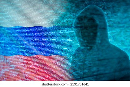 The Silhouette Of A Hacker In Front Of Program Code And Russian Flag