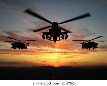 Silhouette of helicopter over sunset
