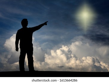 Silhouette Of A Man Pointing At The Bright Shinning North Star For The Concept Of Seeking Mystical Divine Guidance. 