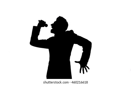 Silhouette of a man who sings in the microphone - Powered by Shutterstock