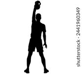 Silhouette muscular man holding kettle bell.