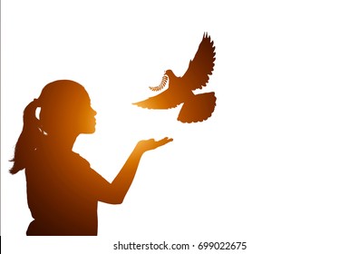 Silhouette Of One Hand Desire To Dove Fly   With Sun Flare Effect At Sunset Time On White Background.