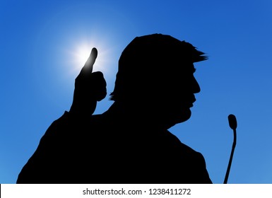Silhouette of the President of the United States of America Donald Trump while attending a conference.