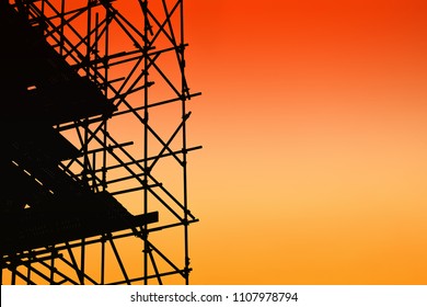 Silhouette Of Scaffolding On Sunset Sky Background