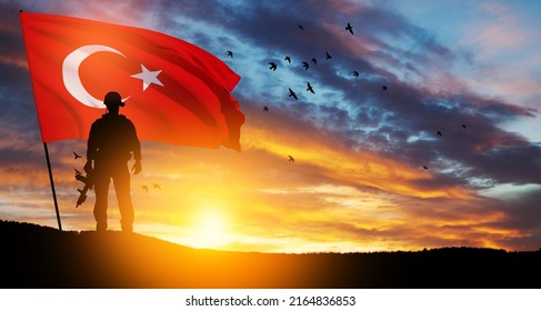 Silhouette Of Soldier With Turkey Flag On Background Of Sunset. Concept Of Crisis Of War And Political Conflicts Between Nations. Greeting Card For Turkish Armed Forces Day, Victory Day.