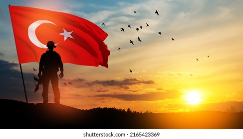 Silhouette Of Soldier With Turkey Flag On Background Of Sunset. Concept Of Crisis Of War And Political Conflicts Between Nations. Greeting Card For Turkish Armed Forces Day, Victory Day.