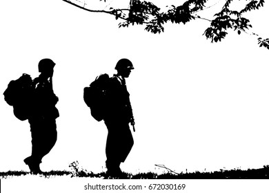 Silhouette Of Soldiers Walking.
