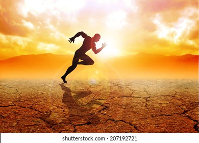 Silhouette of a sprinter running on drought land - Shutterstock ID 207192721