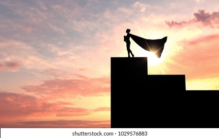 Silhouette Of A Superhero Business Woman Wearing A Cape Against A Bright Sky. 3D Rendering