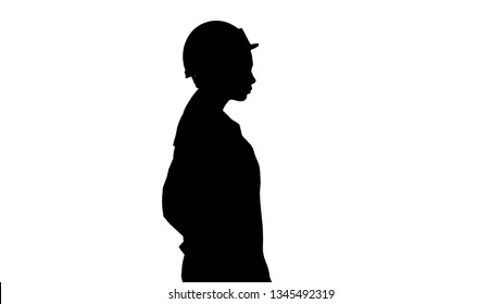 Silhouette Woman In White Robe Putting Hard Hat On While Walking.