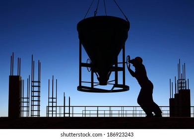 Silhouette of worker and construction