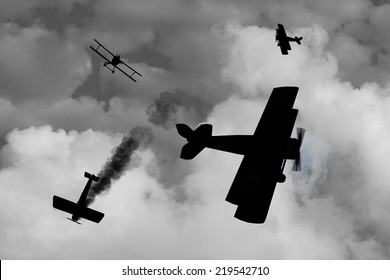 Silhouette  of World War One Aircraft in a dogfight over the battlefields of Europe. British vs Germans. (Computer Art)
