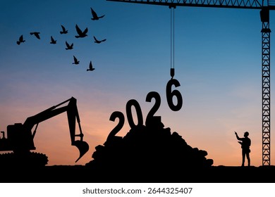 Silhouettes of workers and cranes assembling the number 2026 at sunset, symbolizing the transition into a new year, construction of the future, planning, progress, and new beginnings concept.