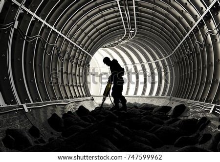 Silhouettes of workers in the mine.