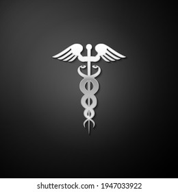Silver Caduceus medical symbol icon isolated on black background. Medicine and health care concept. Emblem for drugstore or medicine, pharmacy snake. Long shadow style.