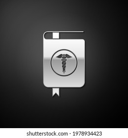 Silver Medical book and Caduceus medical icon isolated on black background. Medical reference book, textbook, encyclopedia. Scientific literature. Long shadow style.