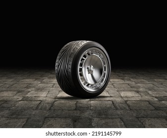 Single Car Tire On A Garage Floor. Rubber Tire With Shiny Chrome Rim From Side View. 3d Rendering, Nobody