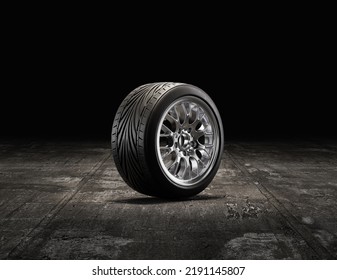 Single Car Tire On A Garage Floor. Rubber Tire With Shiny Chrome Rim From Side View. 3d Rendering, Nobody