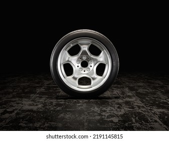 Single Car Tire On A Garage Floor Rubber Wheel With Shiny Chrome Rim. 3d Rendering, Nobody, Front View