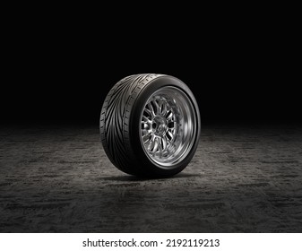 Single Car Tire On A Garage Floor. Rubber Tire With Shiny Chrome Rim From Side View. 3d Rendering, Nobody