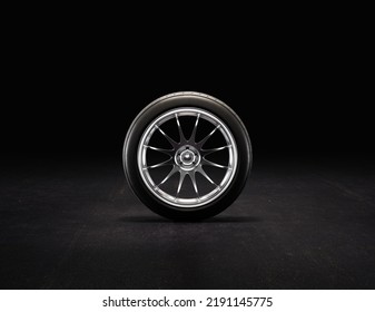 Single Car Wheel On A Garage Floor From Front View. Rubber Tire With Shiny Chrome Rim. 3d Rendering, Nobody