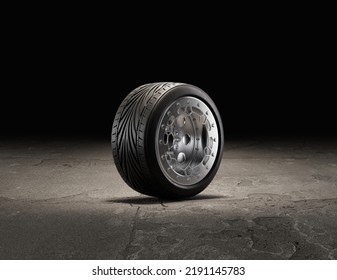 Single Car Wheel On A Garage Floor. Rubber Tire With Shiny Chrome From Side View. 3d Rendering, Nobody