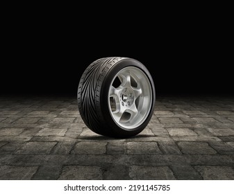 Single Car Wheel On A Garage Floor. Rubber Tire With Shiny Chrome From Side View. 3d Rendering, Nobody