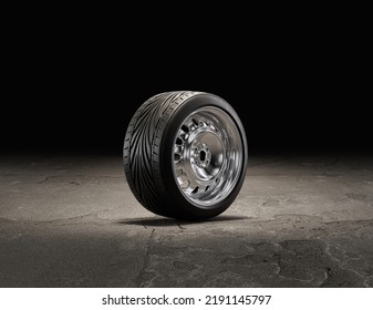 Single Car Wheel On A Garage Floor. Rubber Tire With Shiny Chrome From Side View. 3d Rendering, Nobody