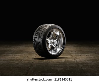 Single Car Wheel On A Garage Floor. Rubber Tire With Shiny Chrome From Side View. 3d Rendering, Nobody