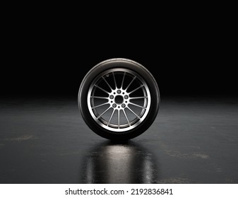 Single Car Wheel On A Garage Floor From Front View. Rubber Tire With Shiny Chrome Rim. 3d Rendering, Nobody