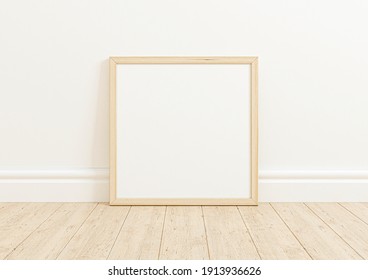 Single square light wood frame mockup on white clean background on wooden floor. Oak frame poster on a white wallpaper. 3D Illustration.
