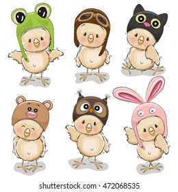 Six cute chicks in different hats on a white background