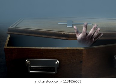A Slightly Open Empty Wooden Coffin With A Hand Reaching Out On A Dark Ominous Background - 3D Render