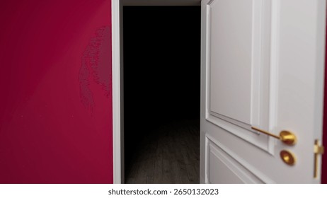 Slightly open white door revealing a dark, empty room with a wooden floor and pink wall, inviting curiosity and evoking a sense of mystery and suspense in the atmosphere
