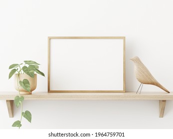 Small Horizontal Wooden Frame Mockup In Scandi Style Interior With Trailing Green Plant In Pot, Bird And Shelf On Empty Neutral White Wall Background. A4, A3 Format. 3d Rendering, Illustration