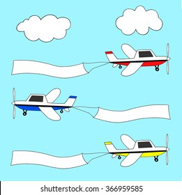 Small planes in three different colors pulling advertising banners.
