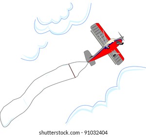 Small red and grey airplane flies between clouds carrying a blank advertising flag.