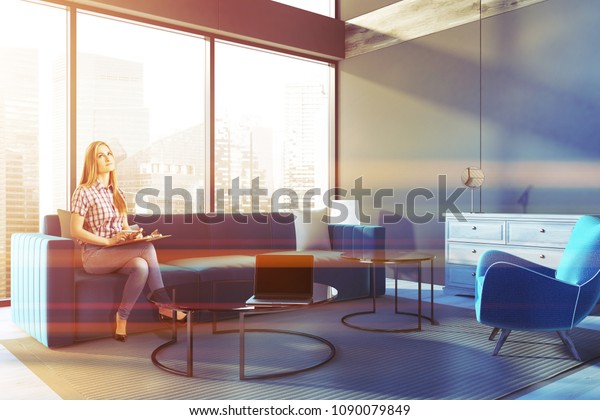 Smiling Blonde Woman Penthouse Living Room Stock