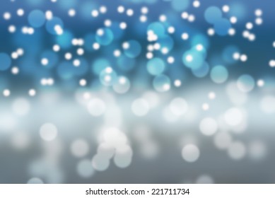Snowy blurry winter holiday background in white and blue