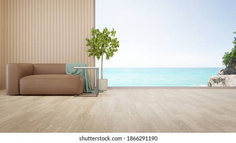 Sofa On Parquet Floor Of Bright Living Room In Modern Beach House Or Luxury Hotel. Minimal Home Interior 3d Rendering With Sea View.