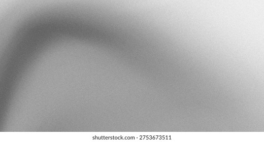 A soft, blurred grayscale image with a vague, shadowy shape hinting at a human face.