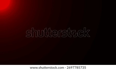 A soft, dark red light emanates from the top left corner, casting a subtle glow on the black background.