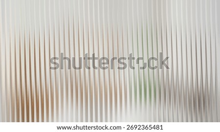 Soft focus abstract ribbed background with subtle color hints
