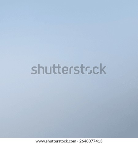 Soft gradient background with sky blue and silver gray tones